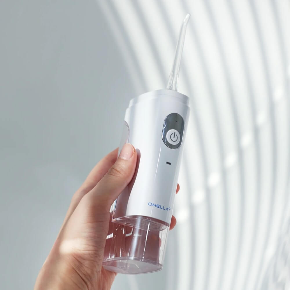 ABKO OHELLA Portable Water Flosser - Hand holding